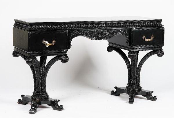 A ebonised dressing table, in period style, with two drawers, on quadrapatite feathered supports, 133cm wide x 80cm high.