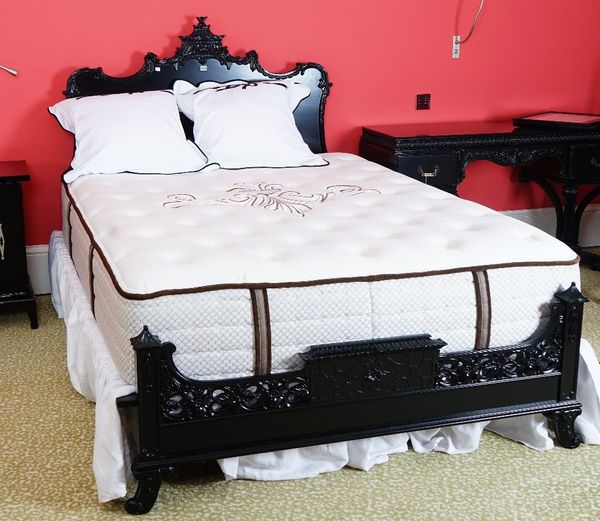 A black lacquered double bed, in Chinese Chippendale style, with shaped headboard and footboard, 130cm wide x 140cm long, with a Stearns & Foster matt