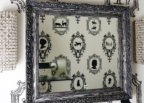 A rectangular wall mirror, in distressed moulded silvered and black painted frame, 80cm wide x 73cm high.