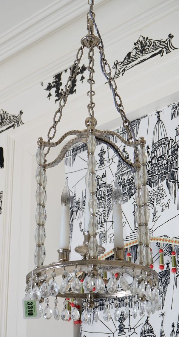 A three light silvered metal frame lantern, with faceted glass columns and drops.