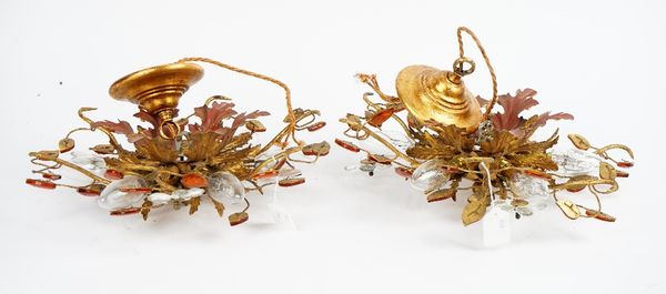 A pair of gilt metal light fittings of a leafy floral design, 38cm wide x 15cm high.