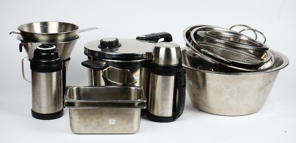 A Fissler pressure cooker, a collection of stainless steel kitchen wares including various bowls and other items (qty).