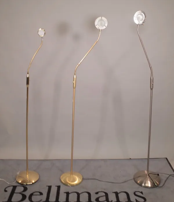 A group of three 20th century brass adjustable floor standing angle poise lamps, each 150cm high (3).  B4
