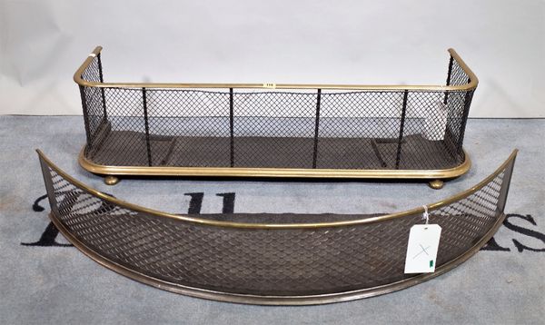 An early 20th century brass and mesh fire fender on bun feet, 108cm wide x 39cm high and another similar with bow front, 112cm wide x 20cm high.  C1