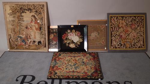 A group of five early 20th century needlework tapestries, the largest 60cm wide x 70cm high, (5).  A1