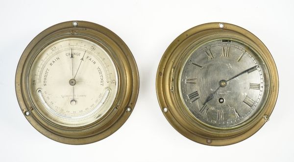 A Negretti and Zambra ships brass cased port hole wall clock, with a 5 inch silvered dial and a similarly cased Negretti and Zambra barometer with the