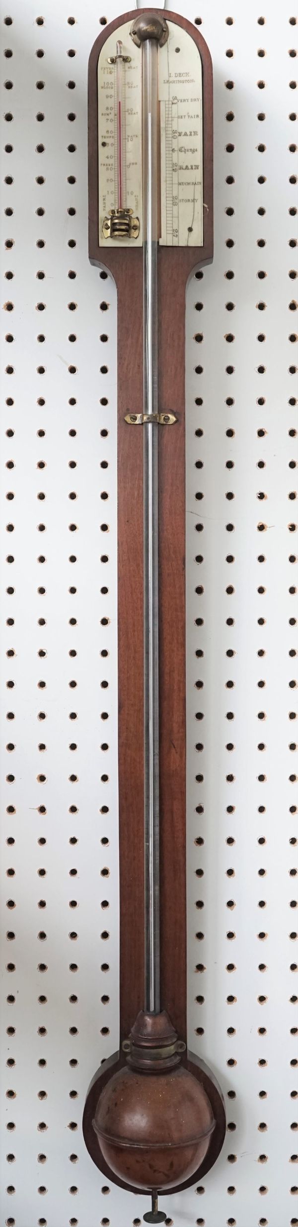 A Victorian mahogany cased stick barometer by I. DECK LEAMINGTON, the ivory plate with subsidiary thermometer over a half black cistern, 94cm.