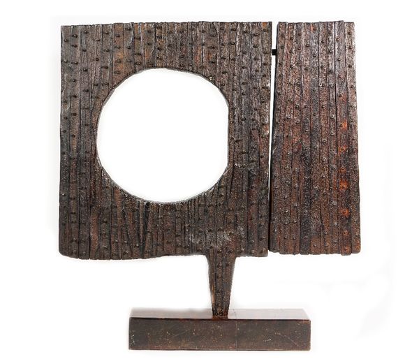 Ronald Mylchreest (South African b. 1920) hardwood contemporary sculpture with iron studded decoration, unsigned on a hardwood base, 71cm high x 65cm