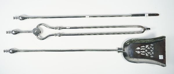 A set of Victorian polished steel fire irons, with turned pommels and a pierced shovel plate (74cm), (3).