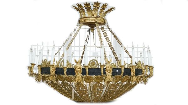 An ormolu and patinated bronze twenty four light chandelier of pierced dished form, 20th century, the crown form corona over foliate cast linked chain