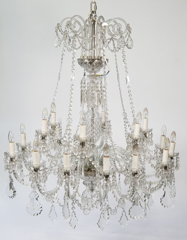 A glass sixteen branch chandelier, 20th century, Venetian style, with spiral twist finials over two graduated tiers united by glass beads and hung wit