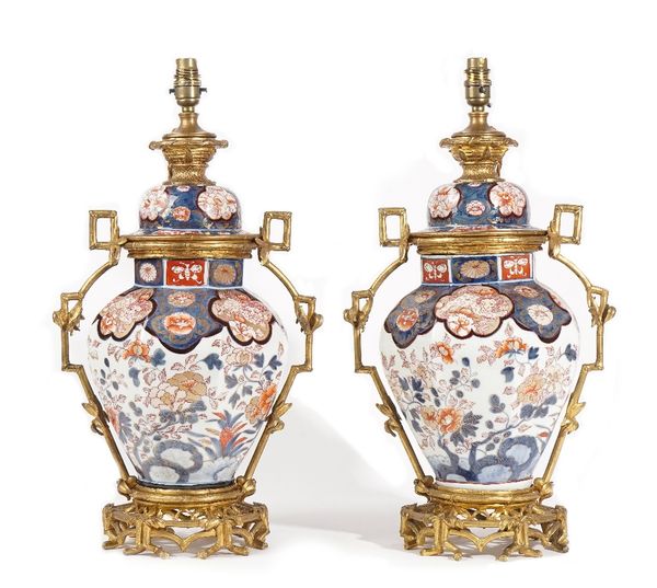 A pair of ormolu mounted Samson porcelain vases and covers (converted to table lamps), late 19th century each Imari decorated against an octagonal bod