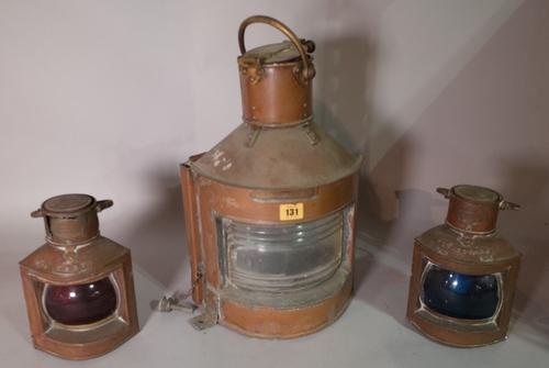 An early 20th century brass ships lantern, 30cm wide x 45cm high and a similar smaller pair, 15cm wide x 23cm high, (3). B3