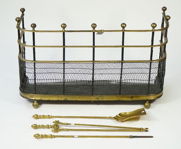 A Victorian brass and wire mesh fire guard, 19th century, with spherical finials and shaped rails over a mesh frieze, 89cm wide, and a set of three Vi