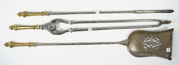 A set of three Victorian steel fire tools with pierced plate and foliate cast brass handles, shovel 75.5cm, (3).