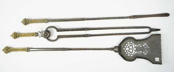 A set of three Georgian steel fire tools with pierced plate and geometric square brass handles, shovel 78cm, (3).