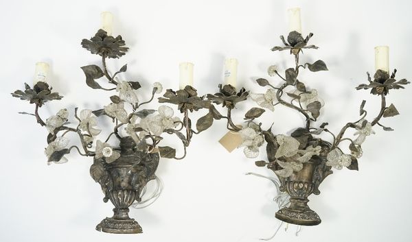 A pair of 19th century white metal and glass three light wall appliques, each cast as flowers protruding from an urn with applied glass leaves, 44cm h