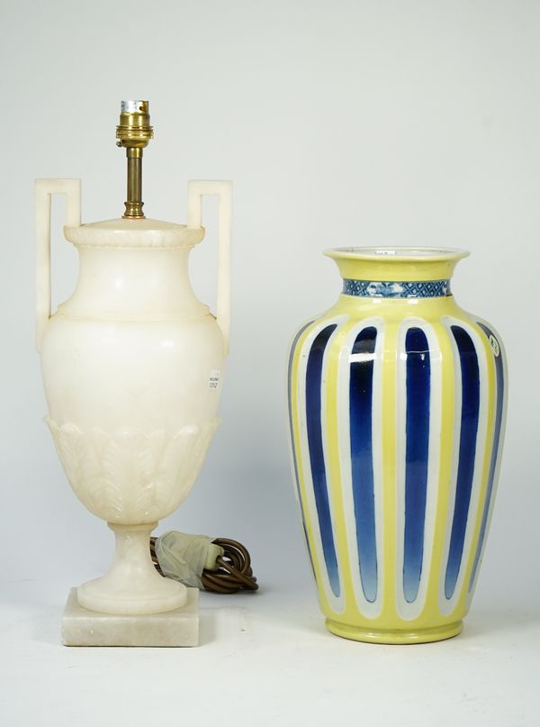 A Chinese style porcelain vase, converted to a table lamp with fluted blue vertical stripes against a yellow and white ground, four character marks to