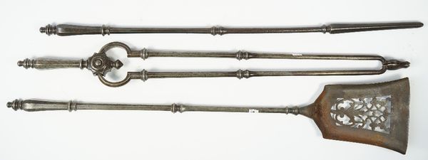 A set of three Victorian steel fire tools, with octagonal tapering handles and knopped shafts, shovel 68.5cm, (3).