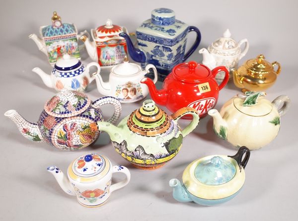 A quantity of 20th century novelty teapots including, Sadler, a Ringtons blue and white teapot, Royal Albert and sundry, the largest 21cm high, (qty).