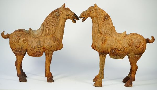 A pair of modern Chinese style Tang horses with rustic patina, 65cm high, (2).