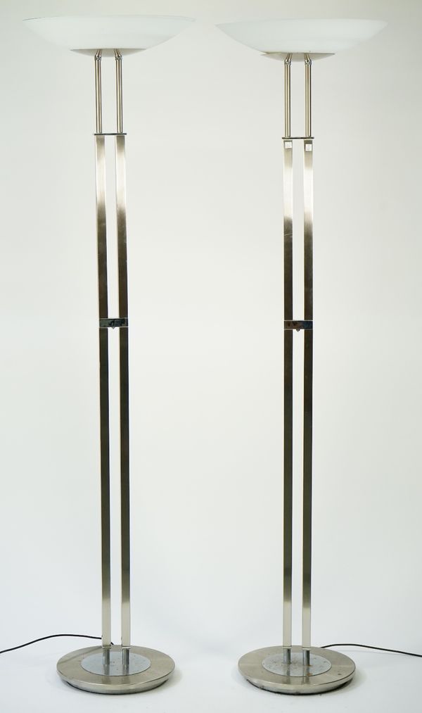 A pair of modern chrome uplighters of square tubular form with frosted glass dished shades, 185cm high, (2).