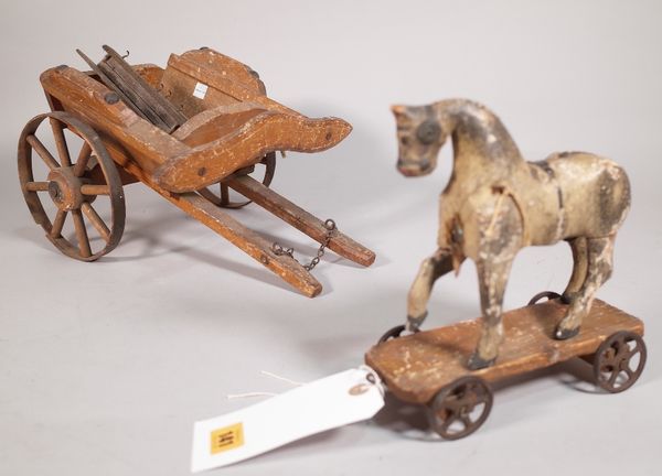 A 19th century painted wooden model of a horse, 20cm wide x 20cm high, a later associated cart, 36cm wide x 18cm high and a miniature hanging plate ra