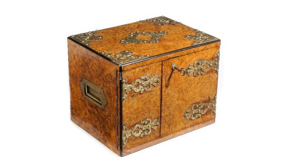 A Victorian brass mounted figured walnut humidor, the pair of doors with Bramah lock, enclosing two drawers, 31cm wide x 24cm high.