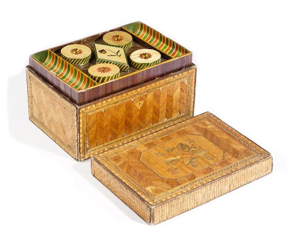 A Napoleonic prisoner of war straw work box, the rectangular lift off top containing a triple layer of lidded boxes, 34cm wide x 20cm high.