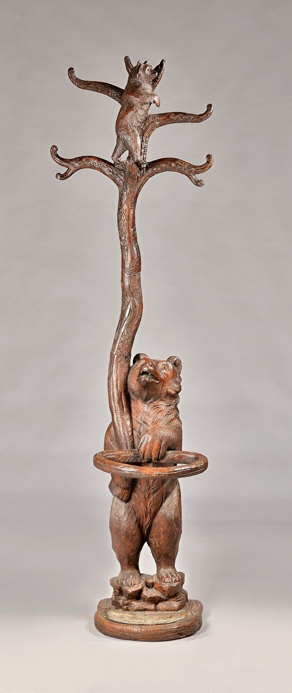 A 19th century Black Forest bear stick stand modelled as a mother and cub in a tree, 197cm high.