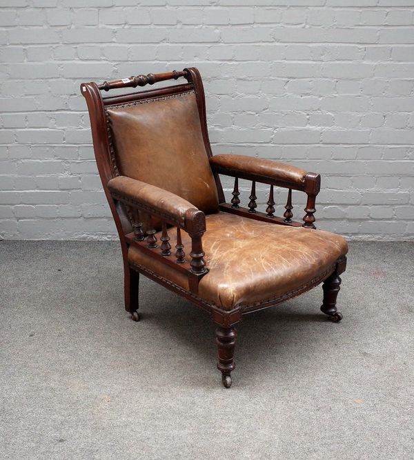 A 19th century mahogany framed leather upholstered easy open armchair with turned supports, 69cm wide x 94cm high.