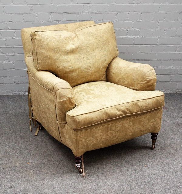 George Smith; a 20th century easy armchair with patterned loose upholstery and turned supports, 80cm wide x 80cm high.