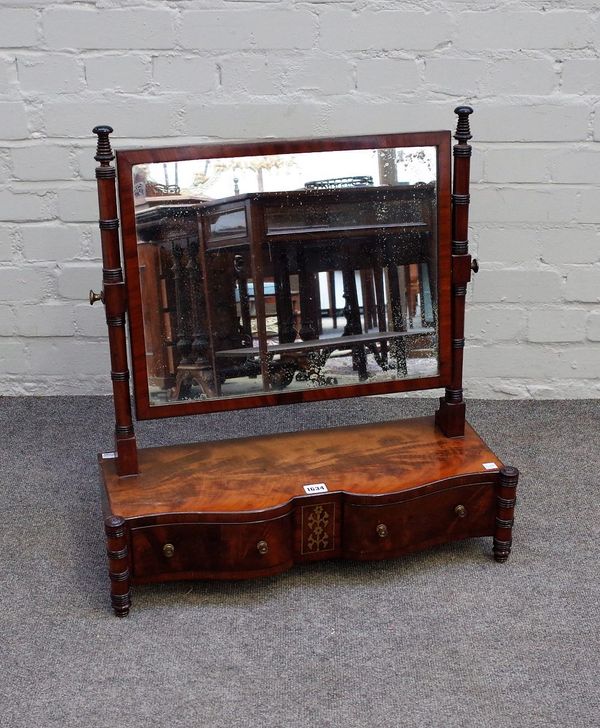 A Regency brass inlaid mahogany toilet mirror with shaped two drawer base and outswept turned supports, 62cm wide x 66cm high.