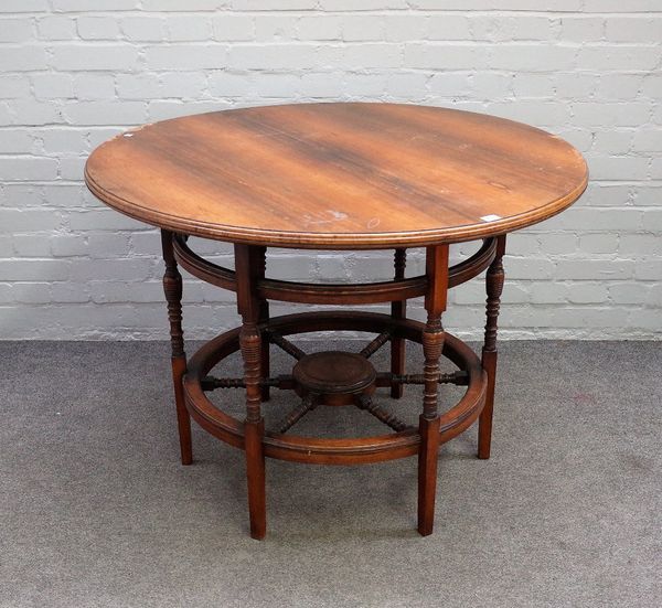 W.Walker & Sons, 119 Bunhill Row, London; an Arts and Crafts rosewood circular centre table on turned supports, united by cartwheel undertier, 106cm d