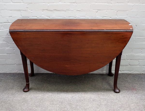 A mid-18th century walnut oval drop flap dining table on pad feet, 126cm wide x 73cm high.