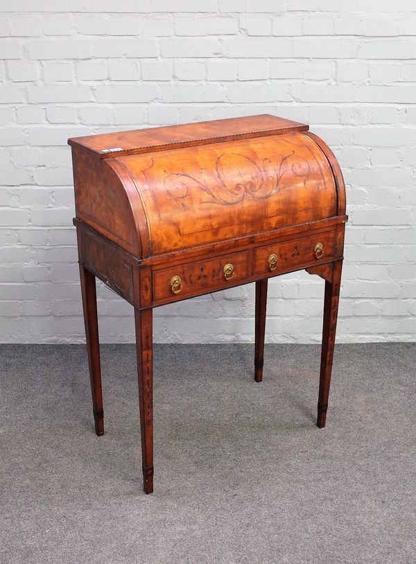 A 19th century inlaid satinwood cylinder writing desk, the pull out fitted interior over pair of frieze drawers on tapering square supports, 70cm wide