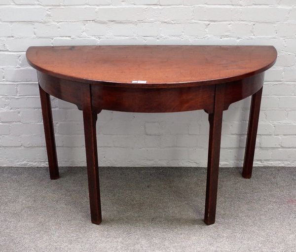 A mid-18th century mahogany demi-lune console table on canted square supports, 121cm wide x 72cm high.