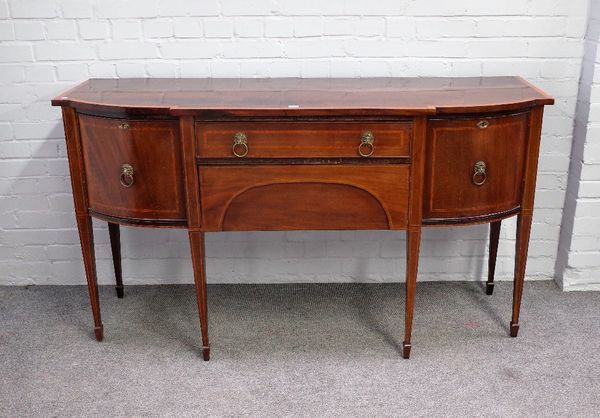 A late George III satinwood banded mahogany bowfront sideboard, with four frieze drawers, on tapering square supports, 165cm wide x 92cm high.