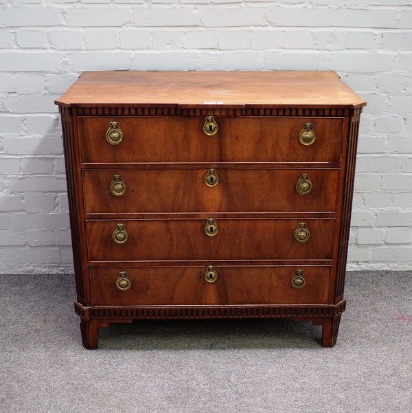 An 18th century Continental walnut four drawer commode with fluted canted corners, 88cm wide x 83cm high.