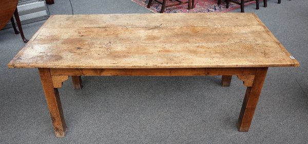 A 19th century kitchen table, the cleated sycamore triple plank top on square fruitwood supports, 86cm wide x 190cm.