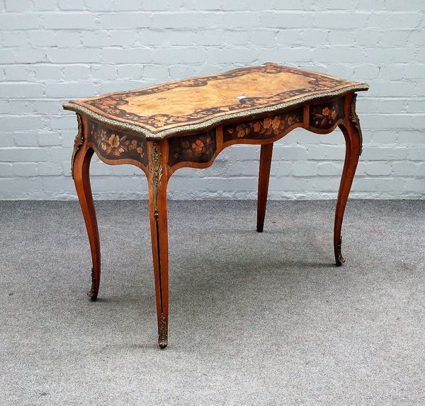 A Victorian gilt metal mounted floral marquetry inlaid walnut centre table, with shaped rectangular top and frieze, on cabriole supports, 110cm x 75cm