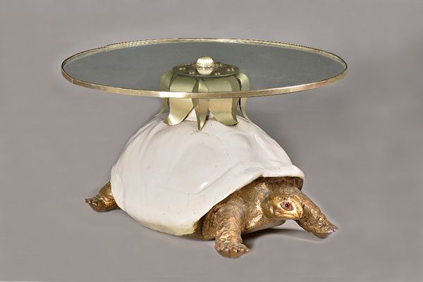 Anthony Redmile; a tortoise coffee table, the banded circular glass top on a resin shelled and metal giant tortoise base, 81cm diameter x 45cm high.