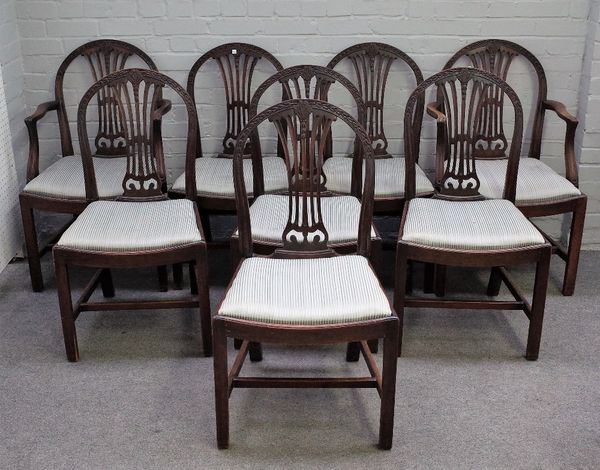 A set of eight Hepplewhite design mahogany arch back dining chairs, on canted square supports, to include a pair of carvers, circa 1900, (8).