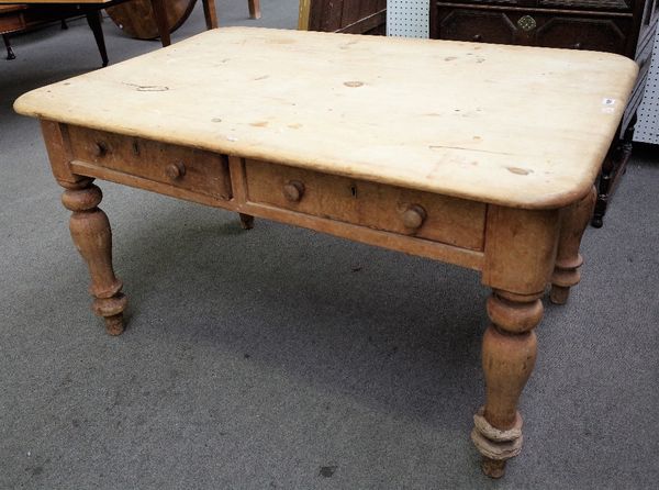 A Victorian pine kitchen table with a pair of frieze drawers on turned supports, 93cm wide x 136cm long.