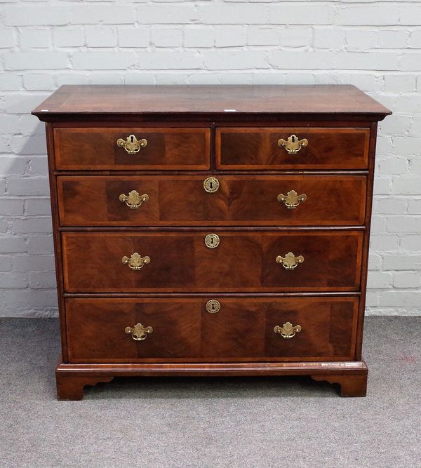 An early 18th century walnut chest of two short and three long graduated drawers on bracket feet, 104cm wide x 94cm high.