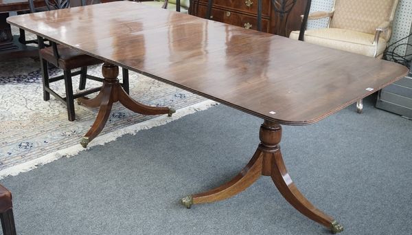 A Regency style mahogany 'D' end extending dining table on six downswept supports, one extra leaf, 103cm wide x 166cm long x 226cm long extended.