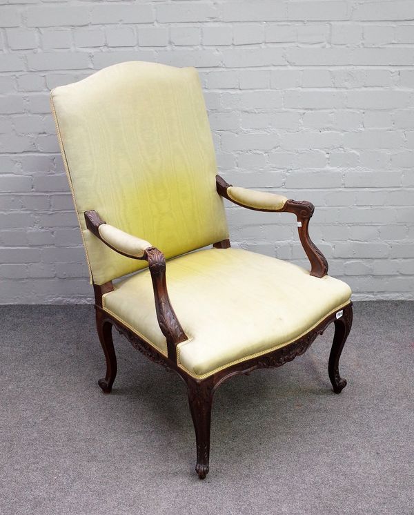 An 18th century style mahogany and beech open armchair on scroll supports, 68cm wide x 105cm high.