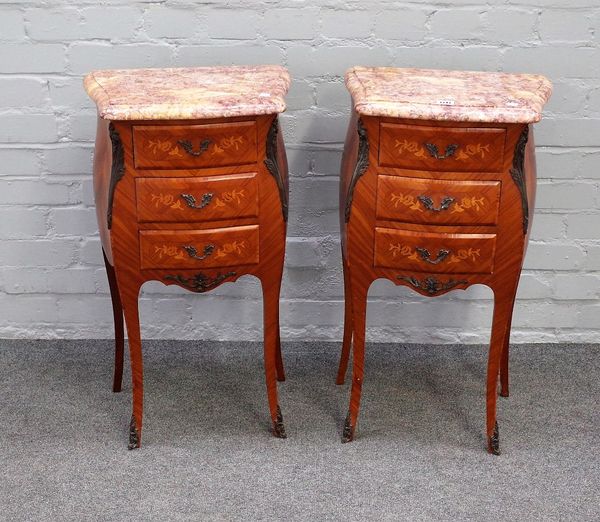 A pair of Louis XV style bombe shape bedside tables, each with marble top over gilt metal mounted marquetry inlaid kingwood three drawer base, on cabr