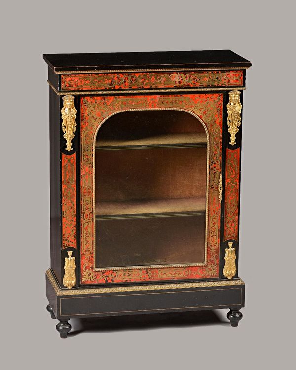 A 19th century gilt metal mounted ebonised boulle work pier cabinet, with single glazed door flanked by caryatid mounts on turned feet, 77cm wide x 10