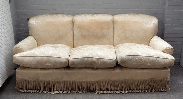 Peter Dugden; a three seat sofa with floral ivory embossed upholstery and tasselled frieze, 225cm wide x 92cm high.